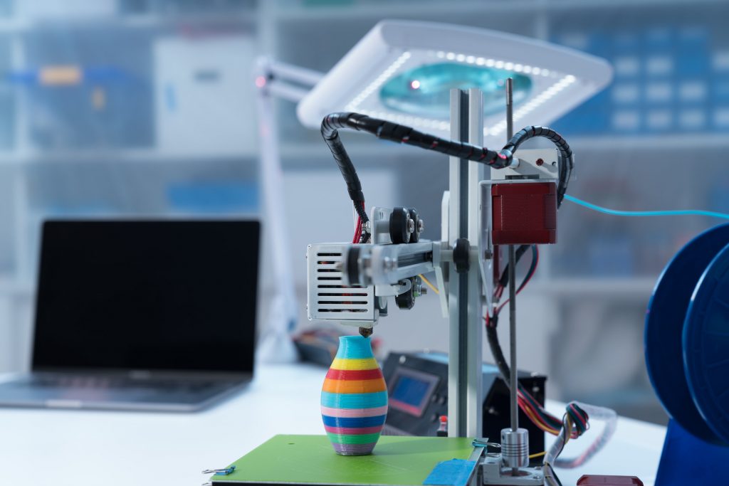 3D printer and computer on the table